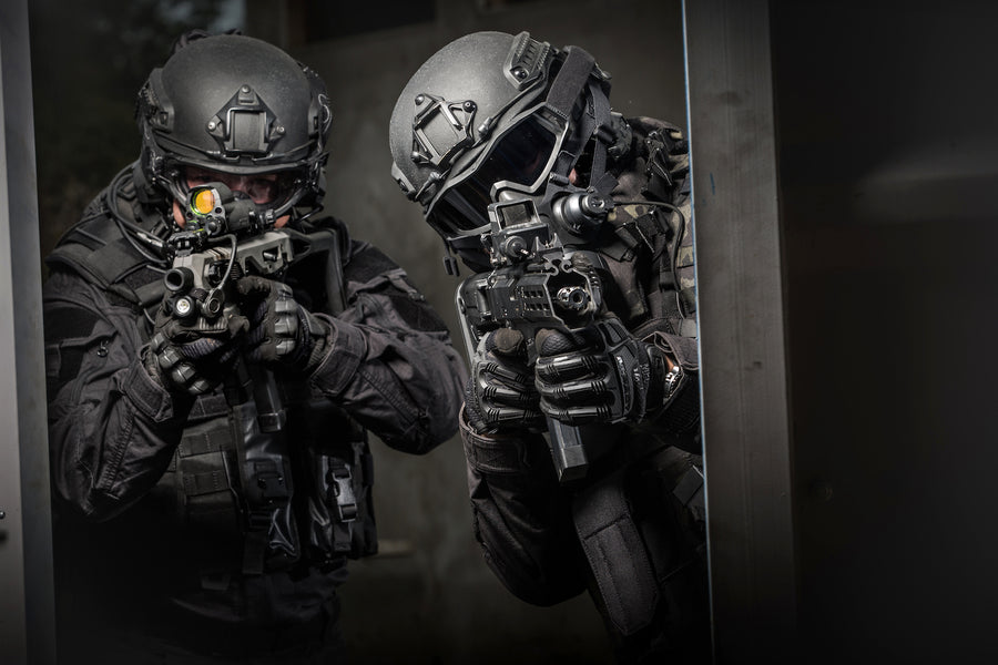 Two SWAT members breaching a door while wearing the Tactical Air-Purifying Respirator mask (TAPR)