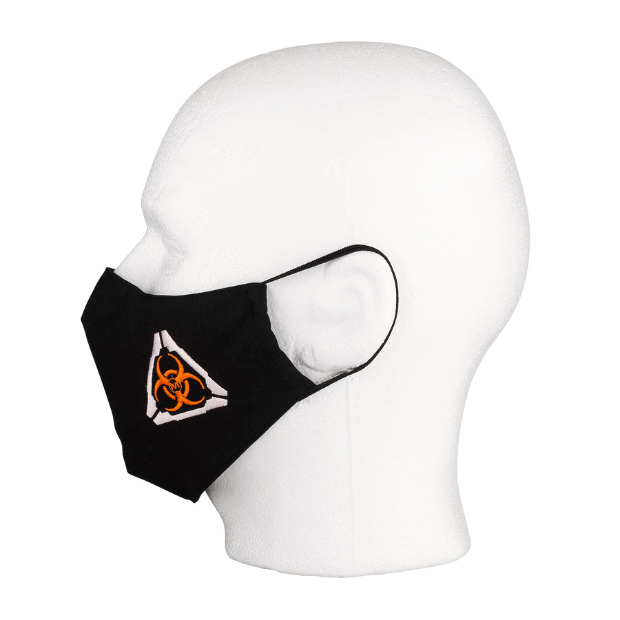 Side view of the MIRA Safety Mask with biohazard insignia on a mannequin head